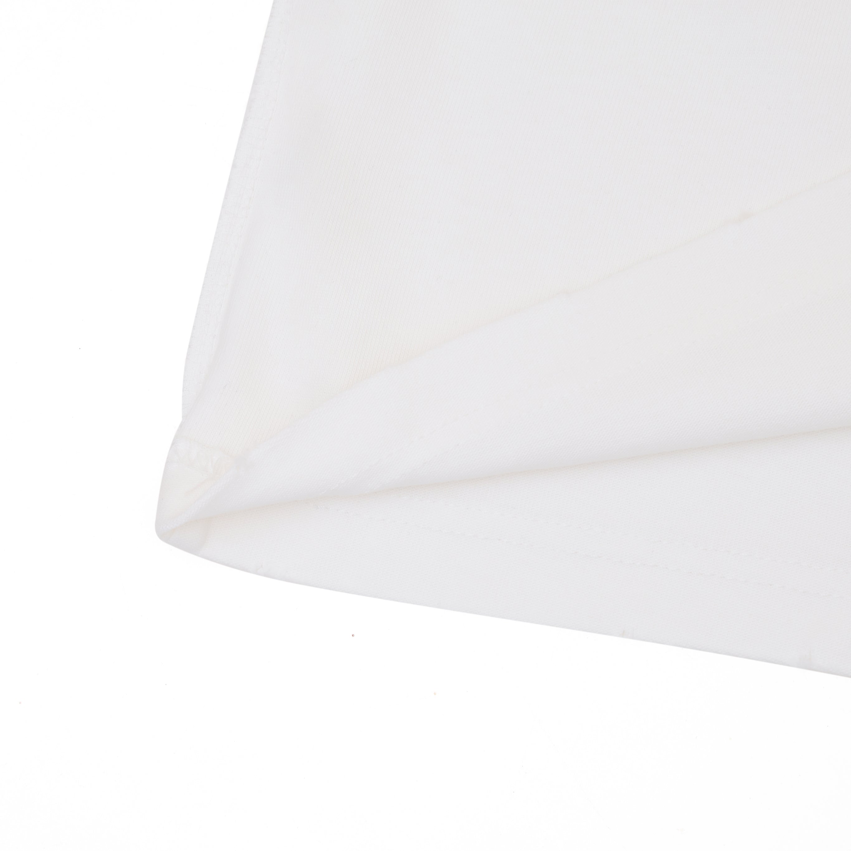 Close-up of a cream tshirt on a white background
