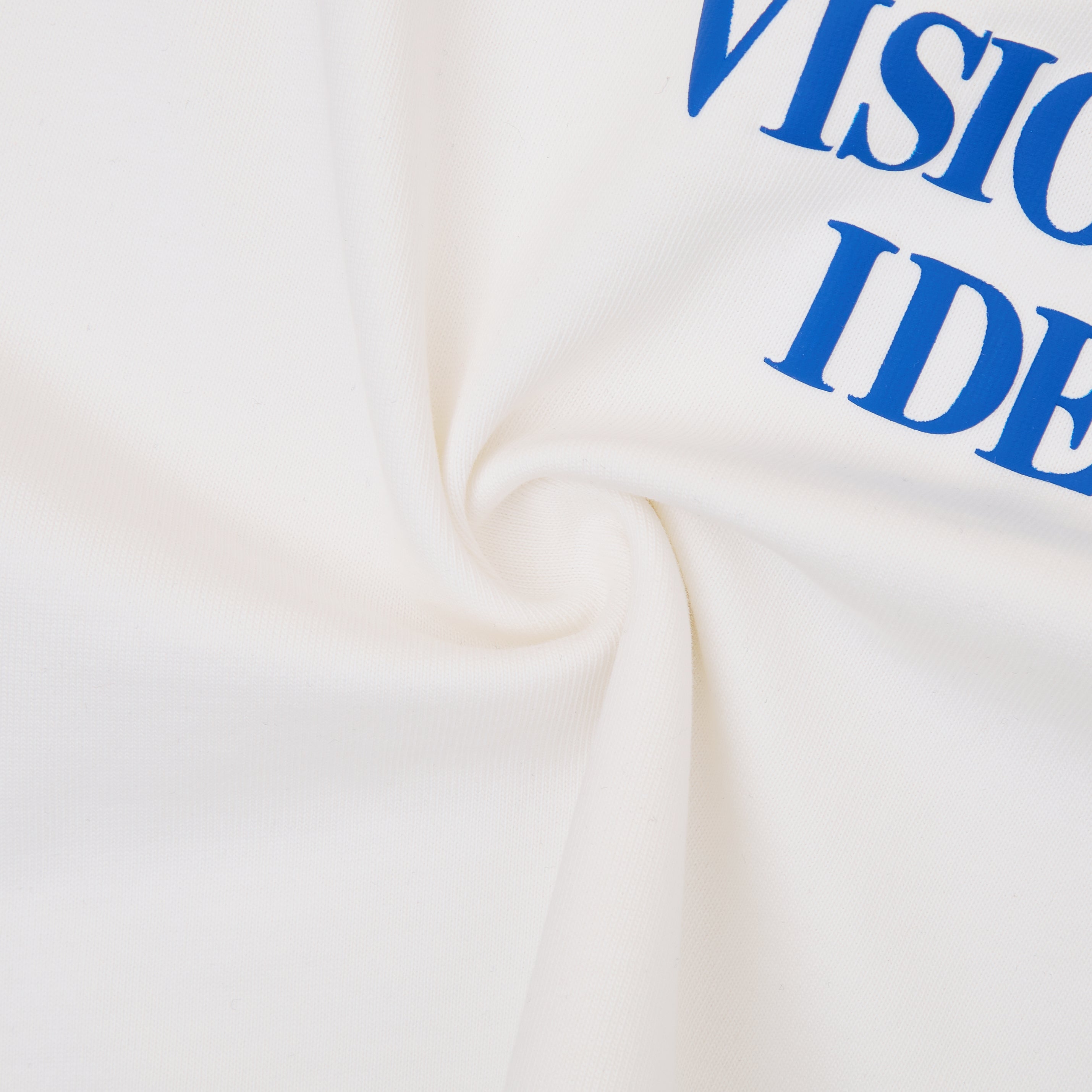 Cream tshirt with blue text on a white background