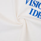 Cream tshirt with blue text on a white background
