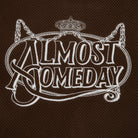 Embroidered text 'Almost Someday' on a brown textured background