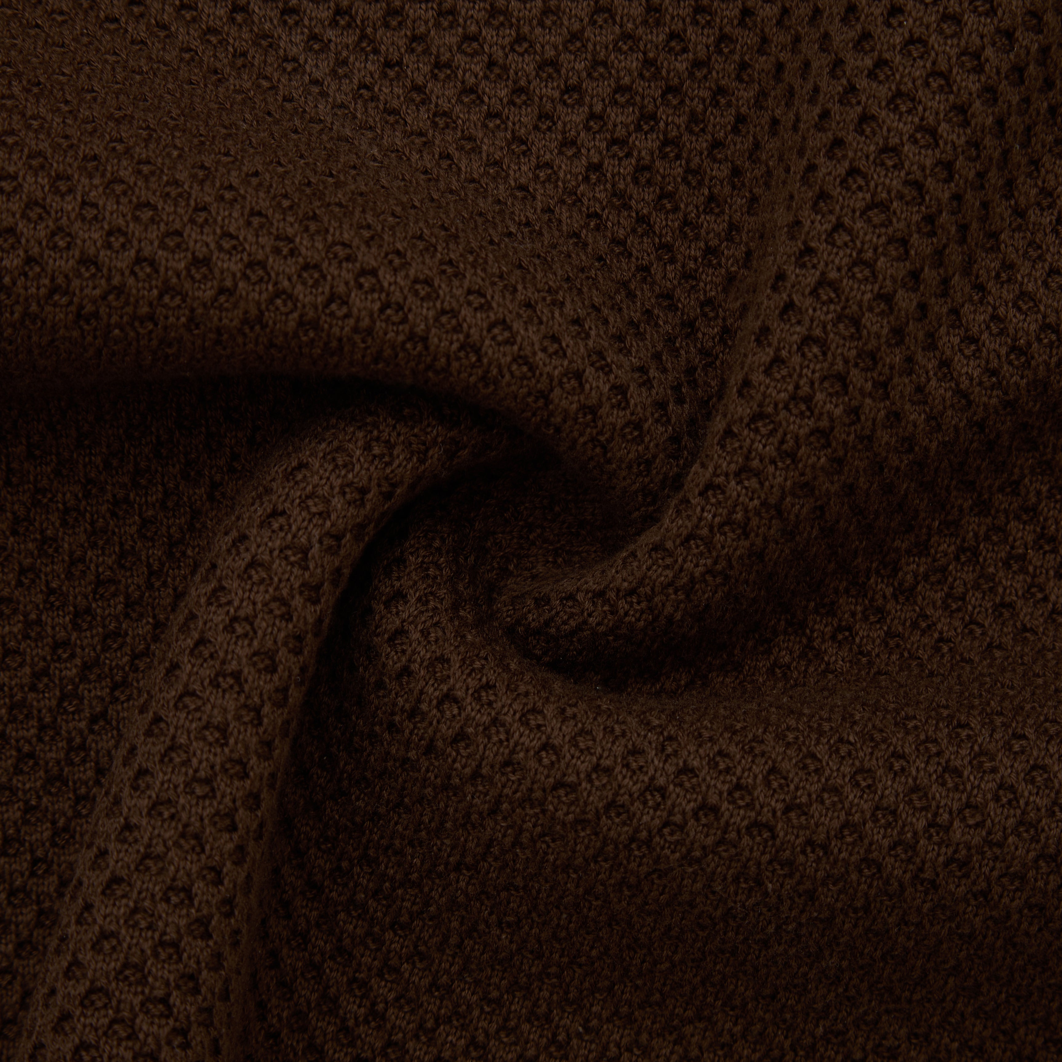Close-up of brown textured fabric with a subtle pattern