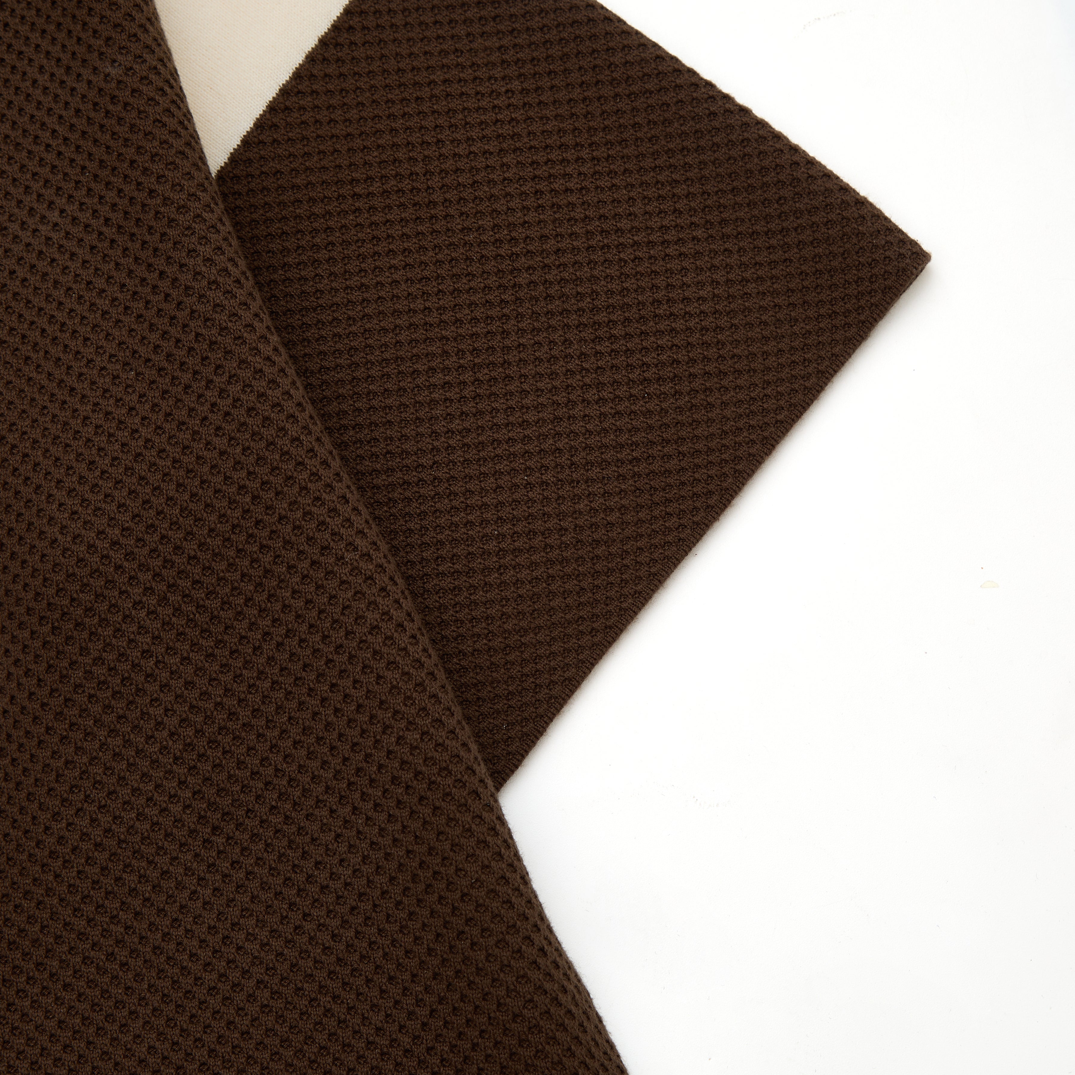 Brown textured fabric on a white background