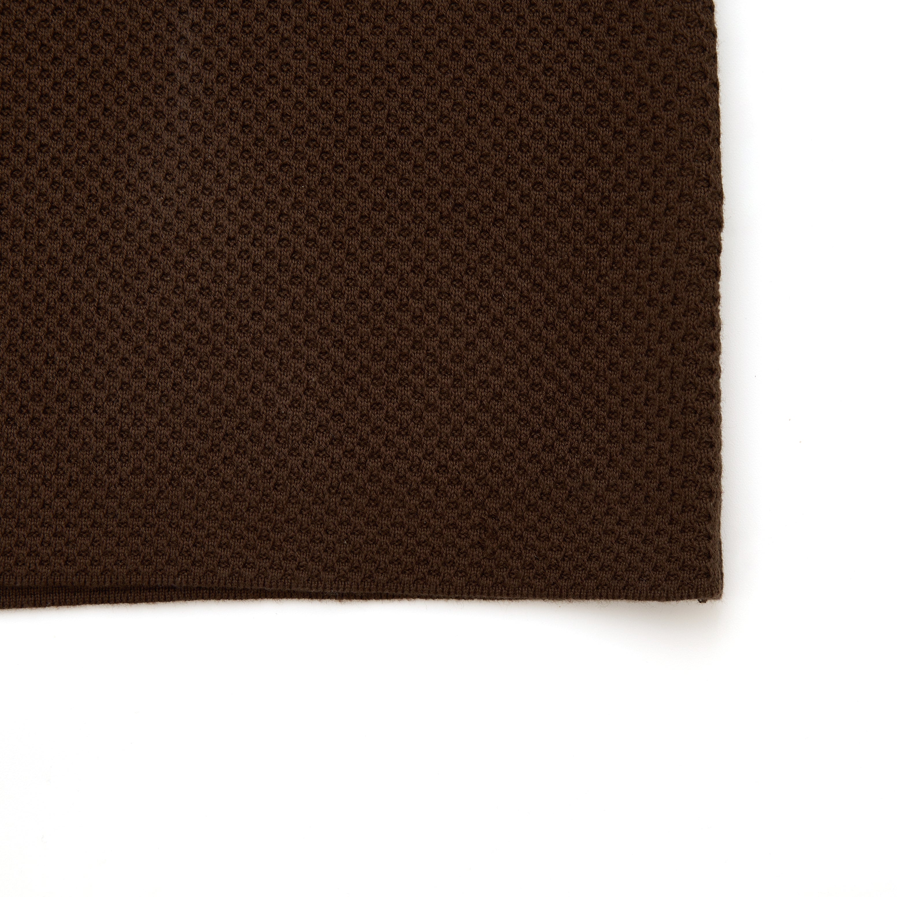 Brown textured fabric on a white background