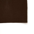 Brown textured fabric on a white background