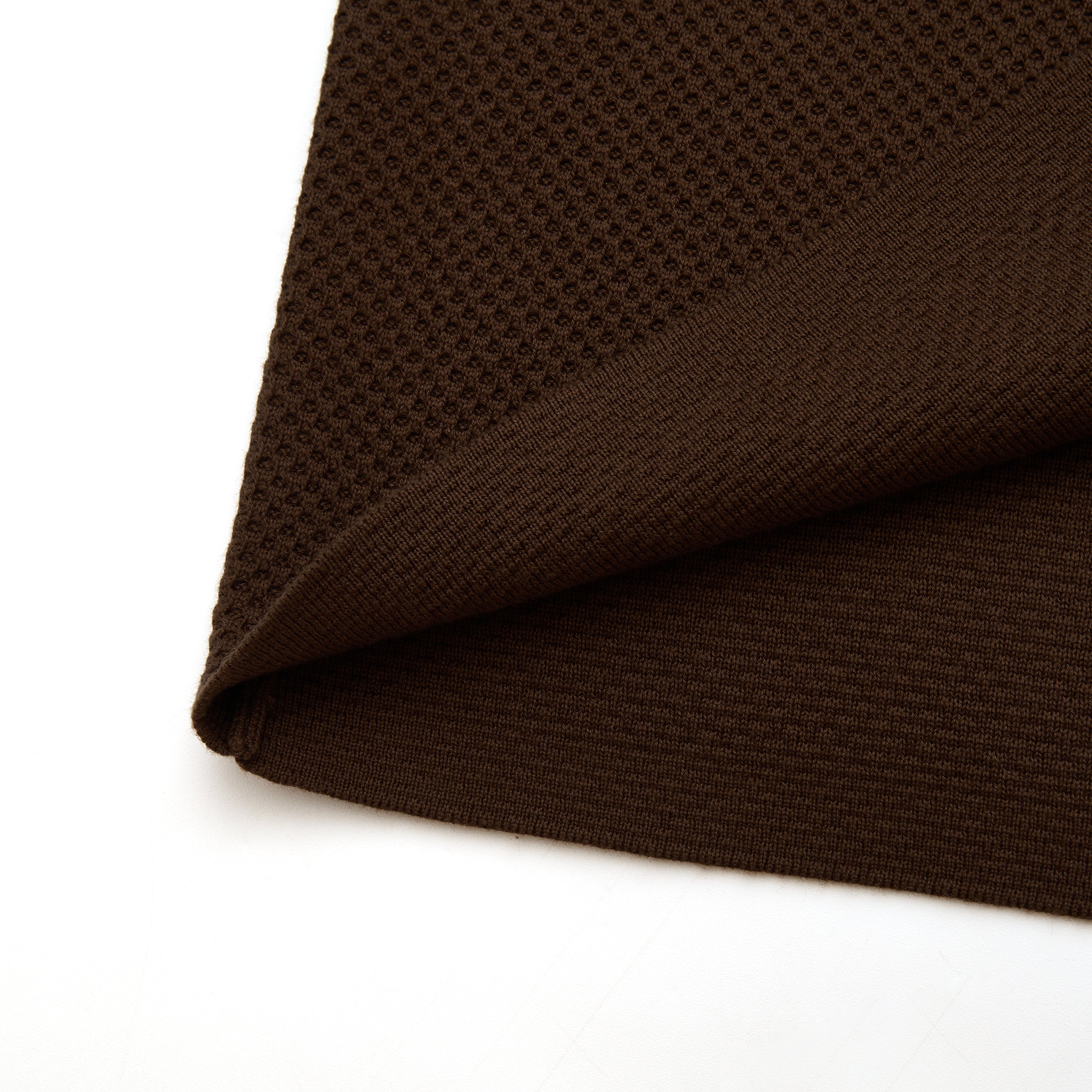 Brown textured fabric on a white background