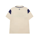 Beige polo shirt with navy accents on a white background