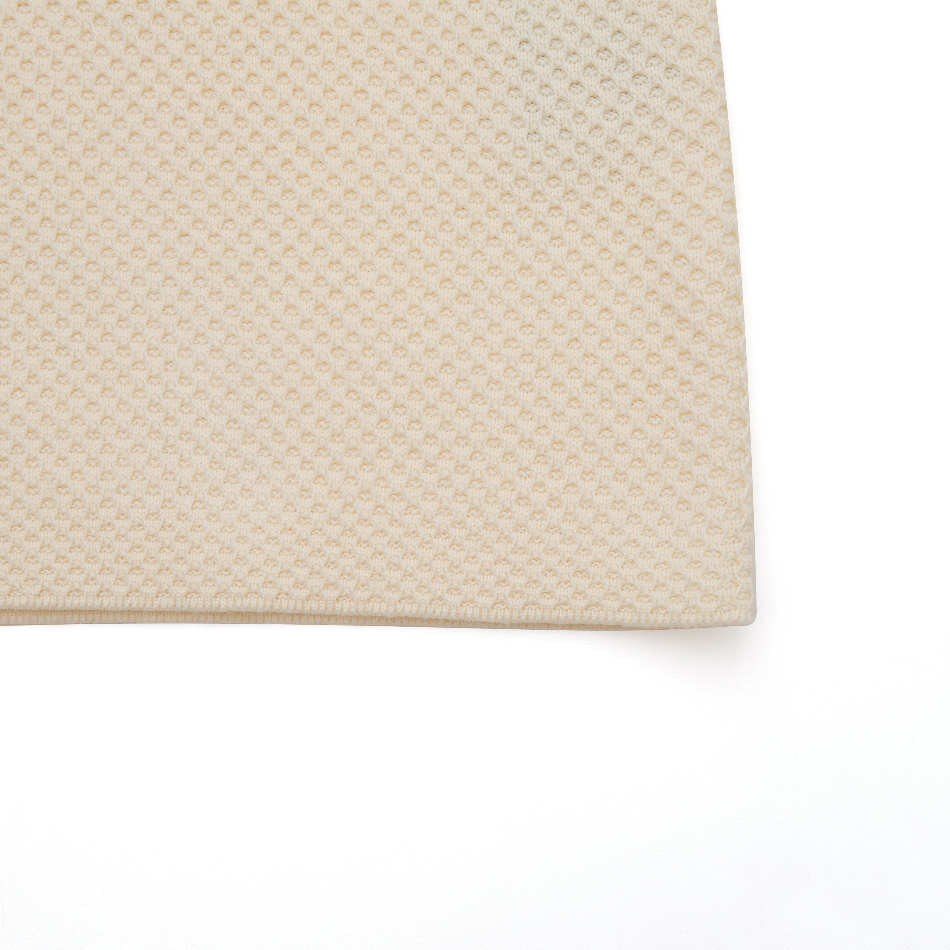 Beige textured rug on a white background