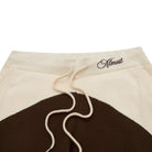 Shorts with a brown and beige design and 'Almost' text on a white background