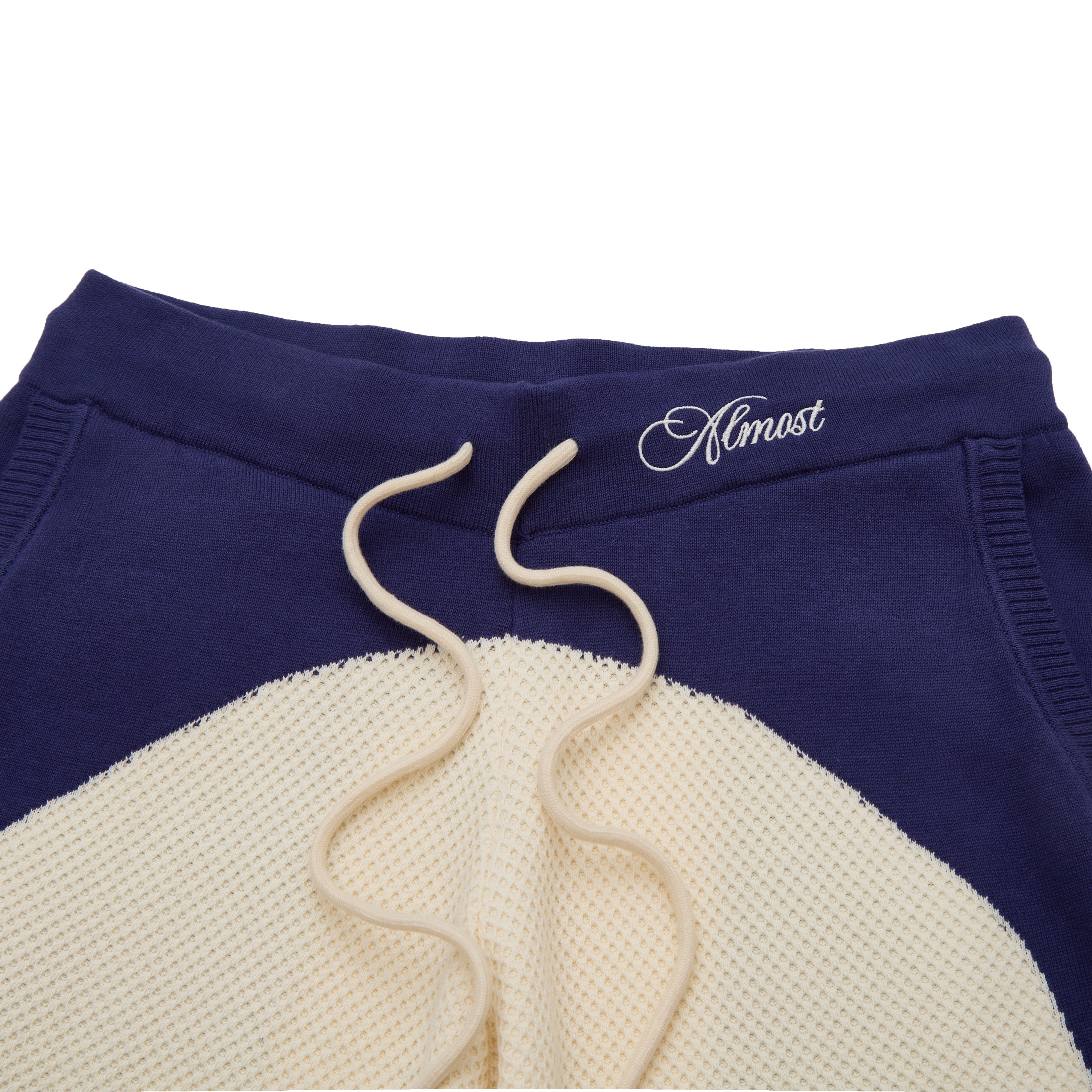 Blue and beige sweatshirt with 'Almost' logo on a white background