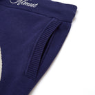 Navy blue shorts with ribbed cuffs on a white background