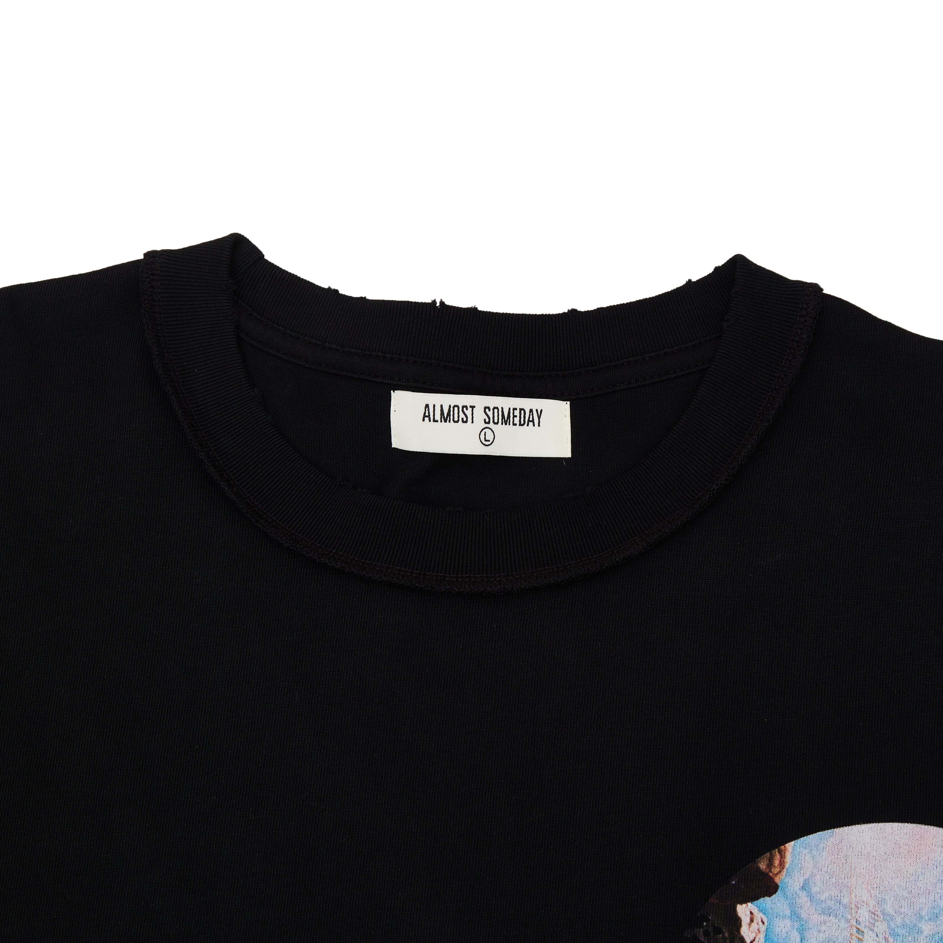 Black t-shirt with 'Almost Someday' label on a white background
