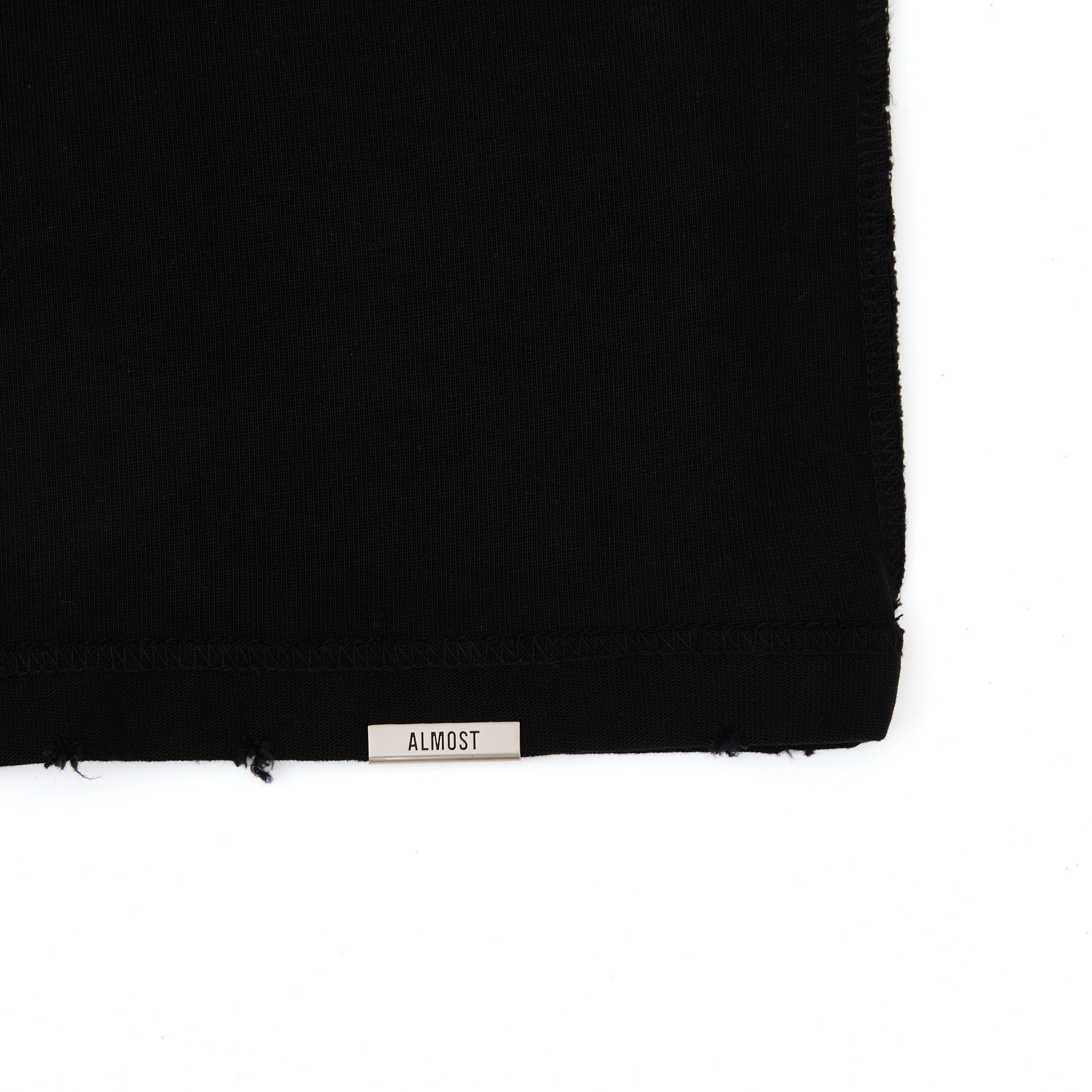 Black fabric with a 'Almost' label on a white background