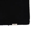 Black fabric with a 'Almost' label on a white background