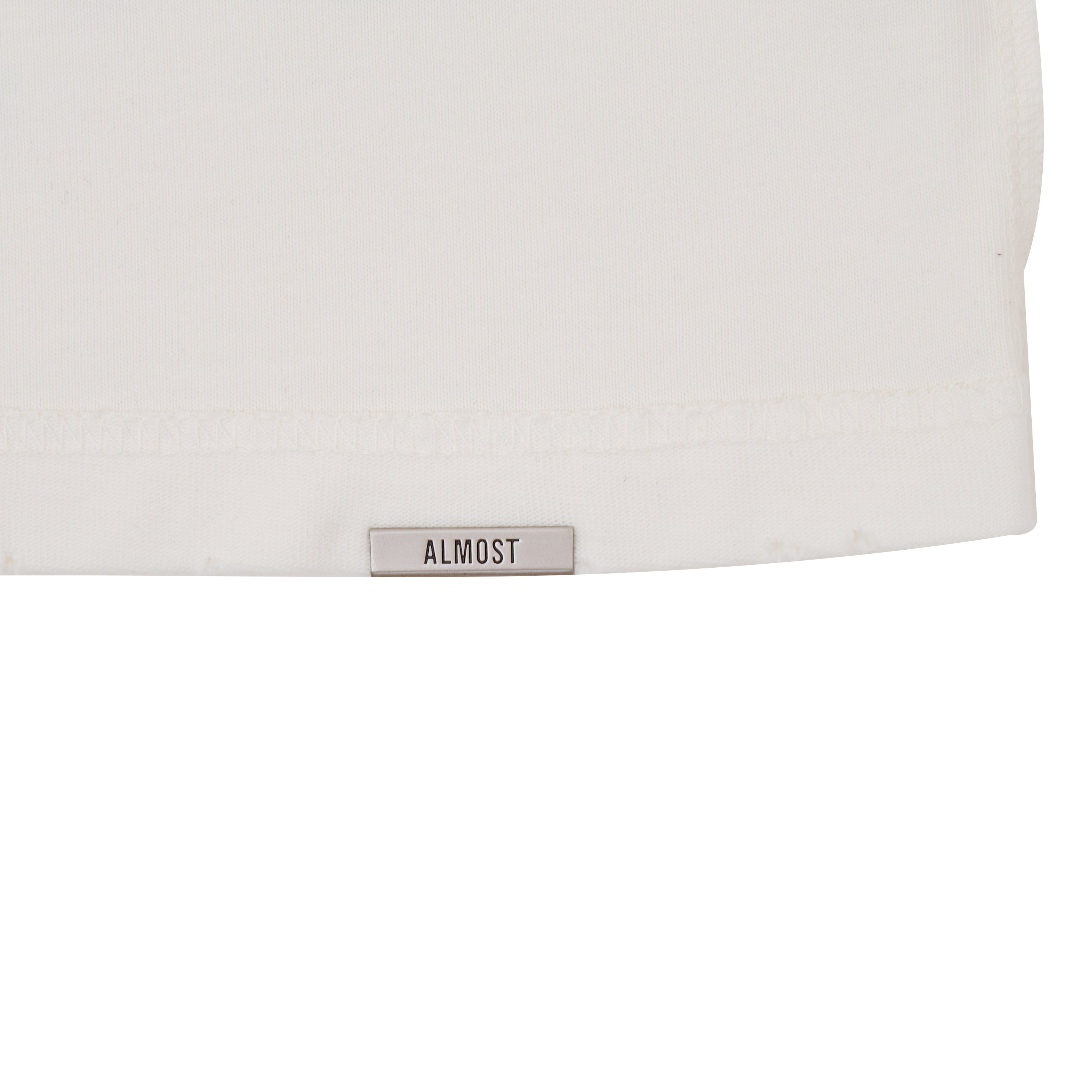 White tshirt with a 'ALMOST' label on a white background