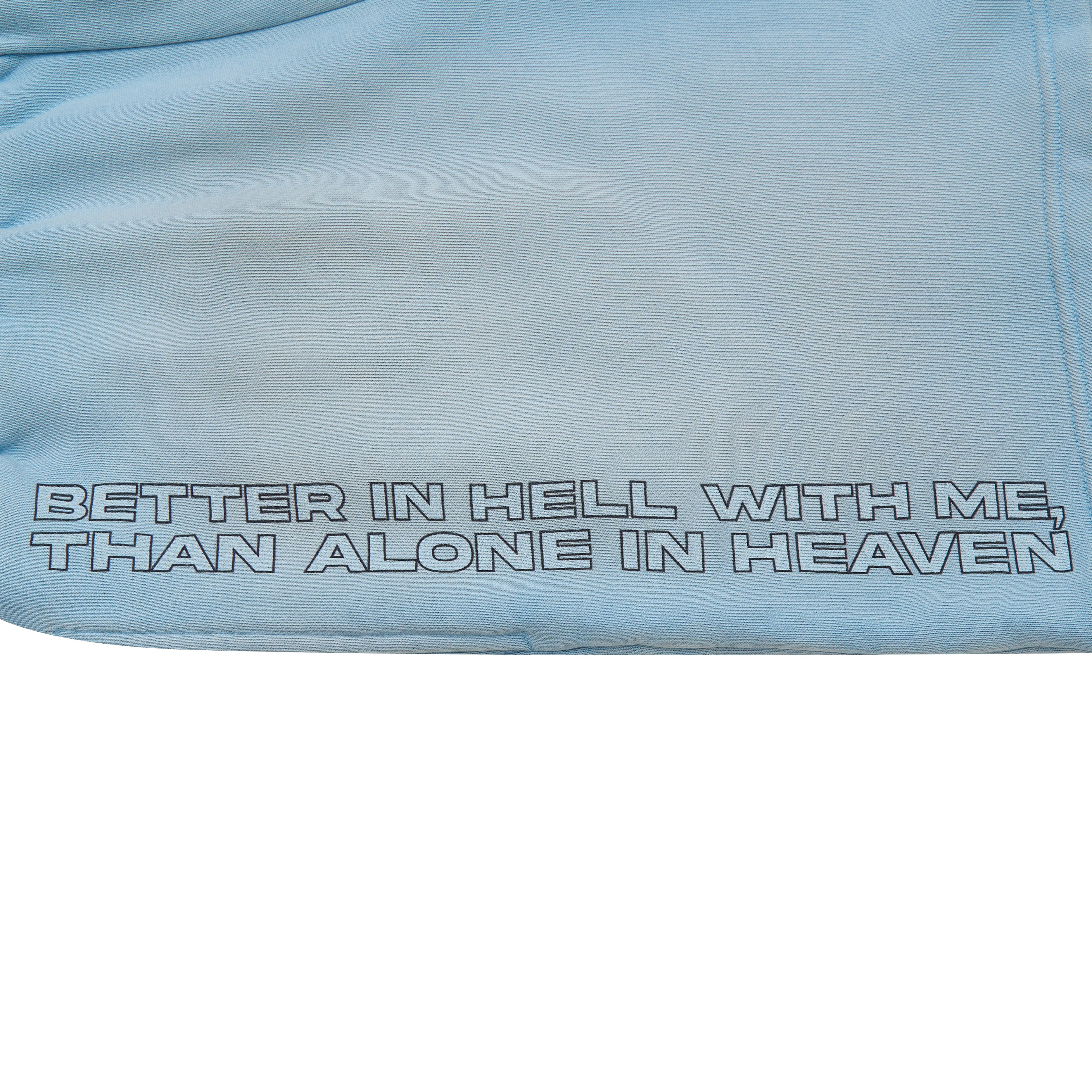 Light blue fabric with text 'Better in hell with me, than alone in heaven' embroidered on it.