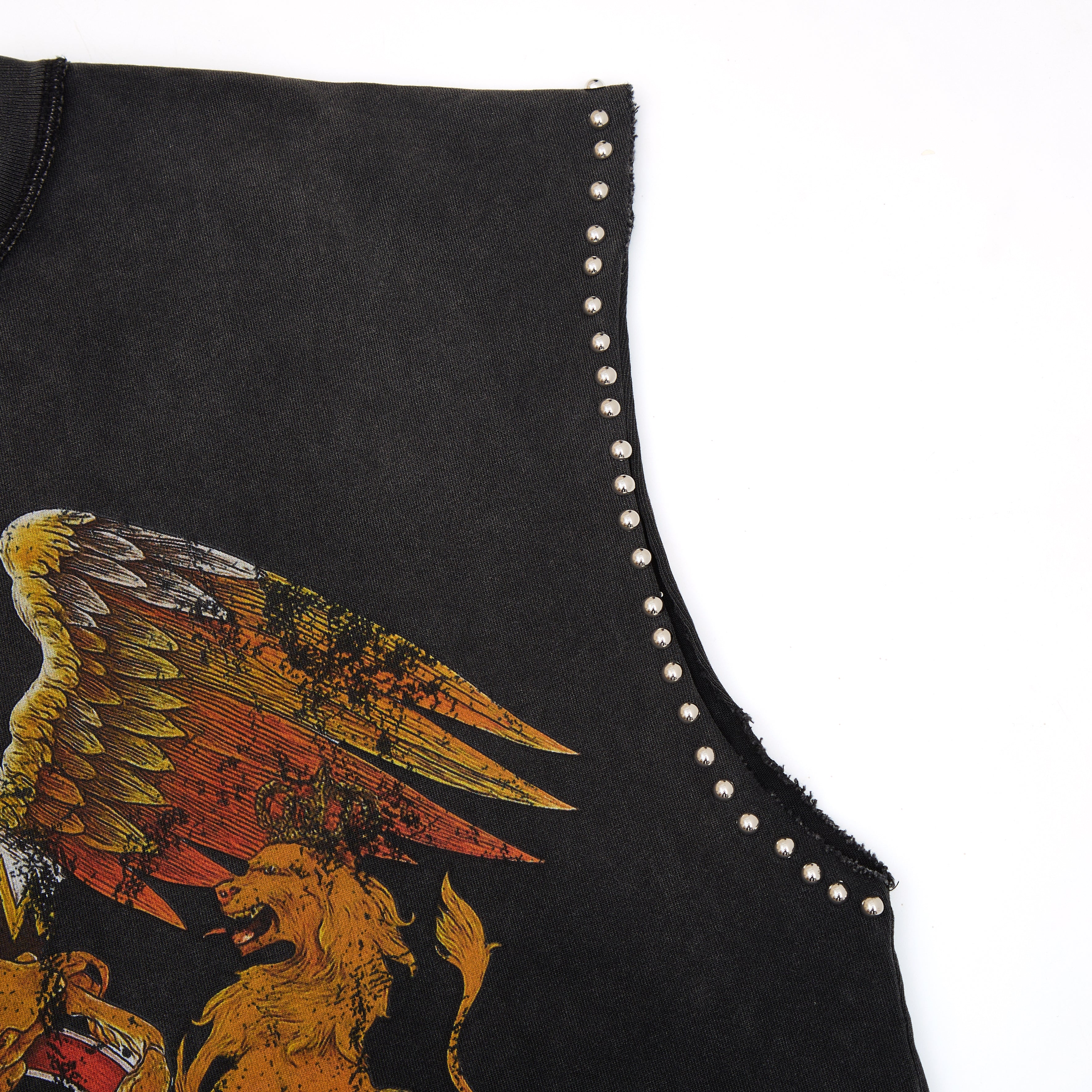 Black sleeveless top with gold eagle and lion design and studded details on a white background
