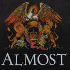Decorative emblem with lions and an eagle on a dark background, featuring the word 'ALMOST'.