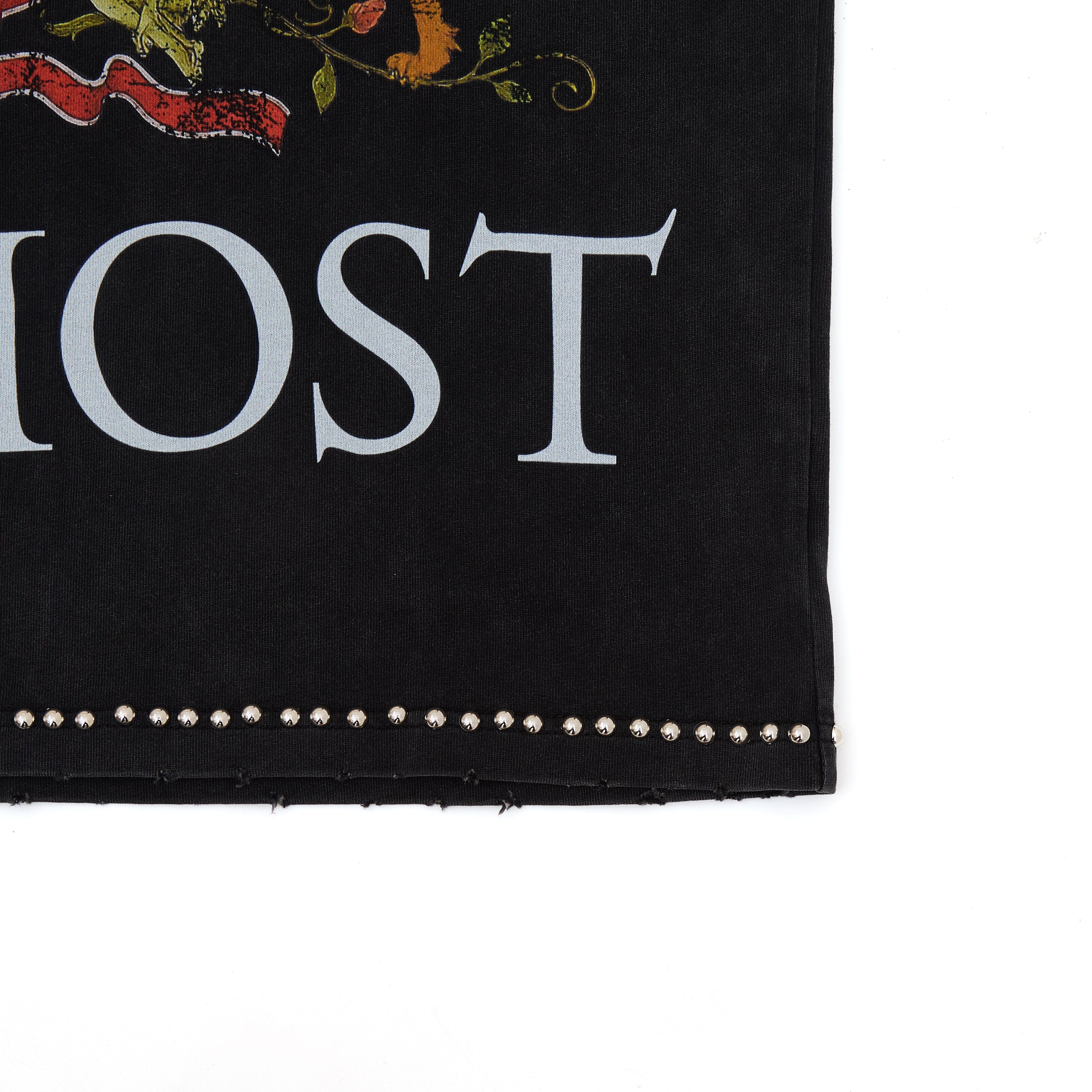 Black fabric with white text 'ALMOST' and decorative elements on a white background