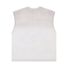 White sleeveless top with decorative trim on a white background