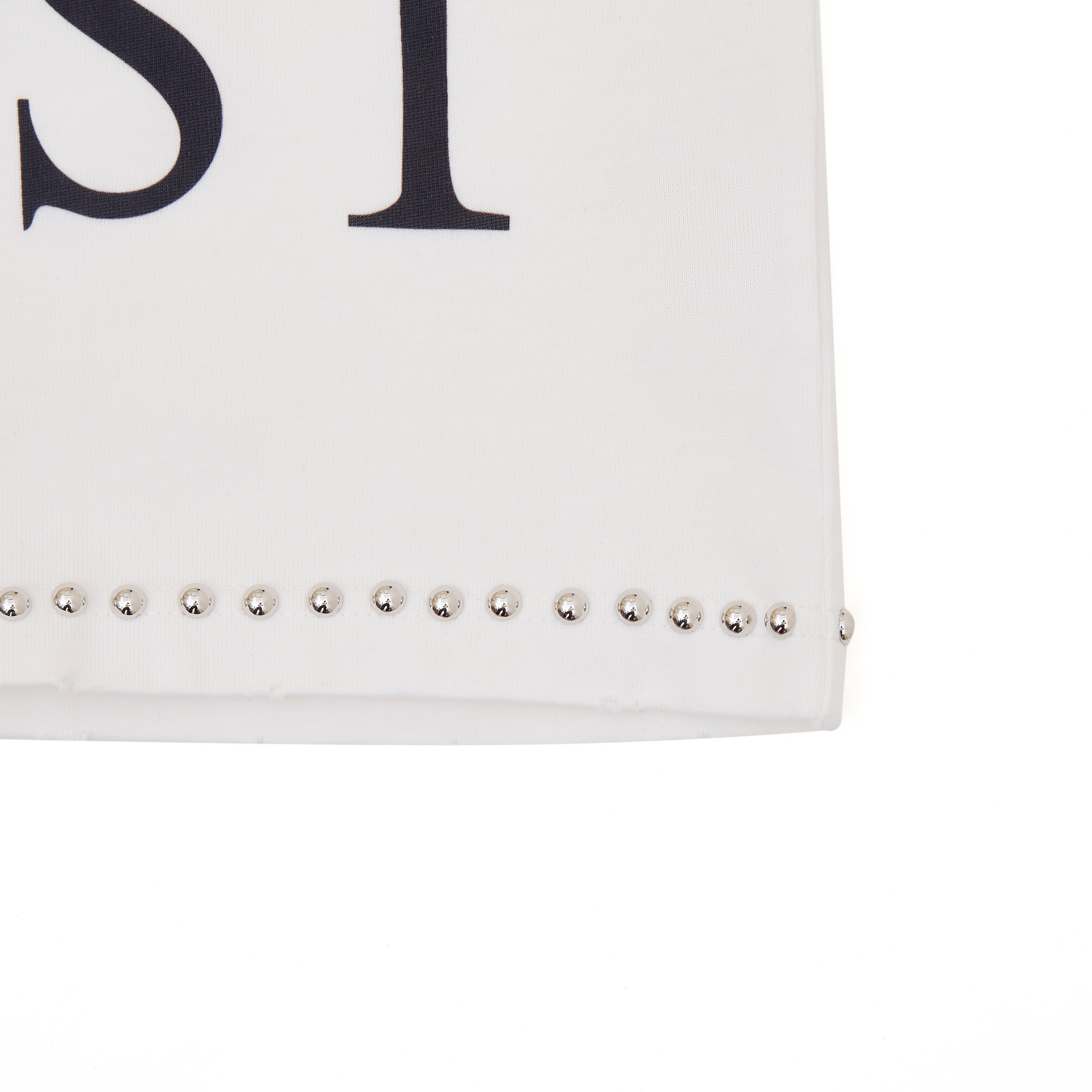 White clutch with studded details on a white background