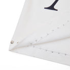 White fabric with decorative studs on a white background