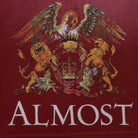  Heraldic design with an eagle and lions on a red background with 'ALMOST' text.
