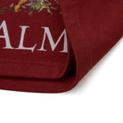 Close-up of a red fabric with 'ALMOST' branding on a white background