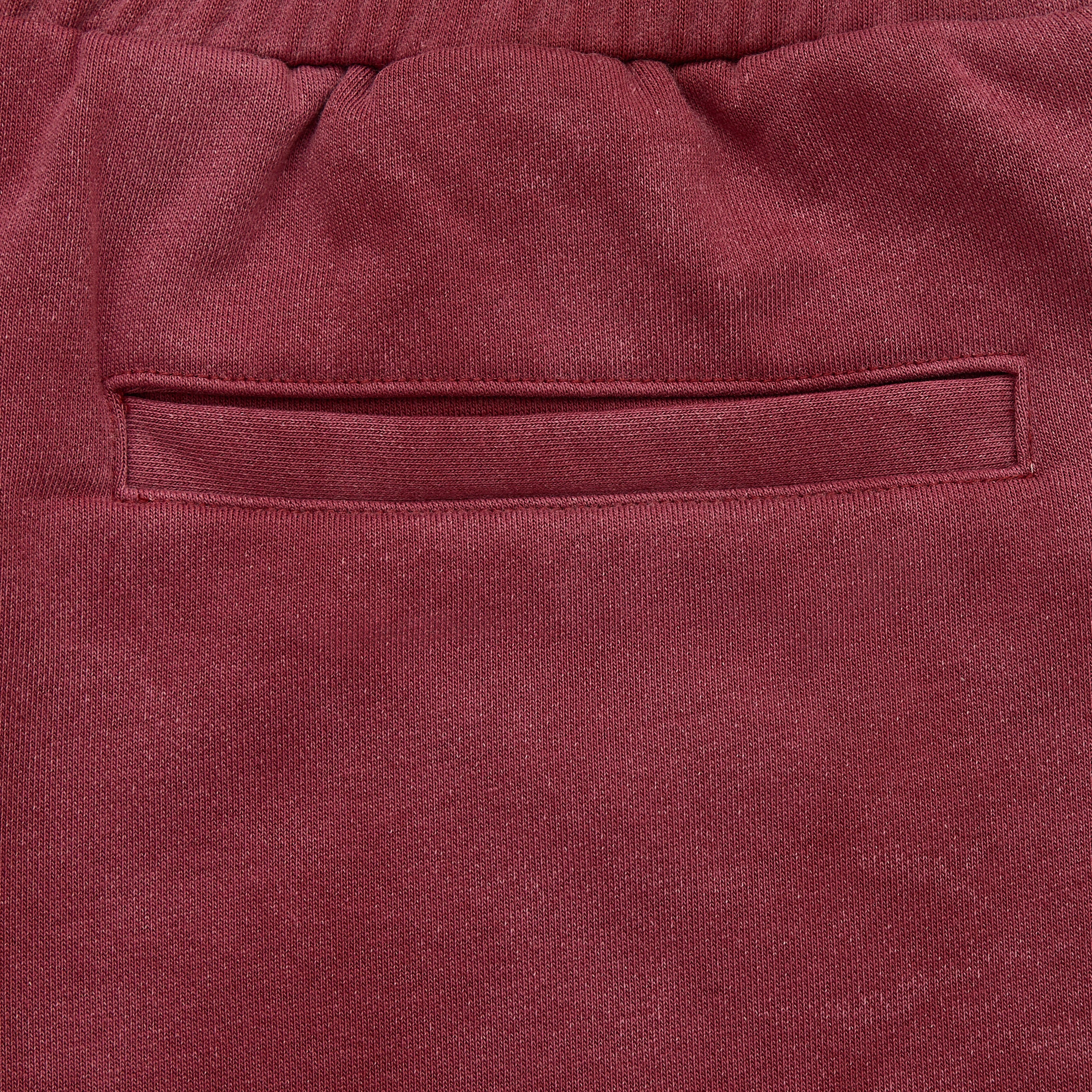 Close-up of a maroon fabric pocket