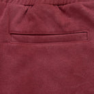 Close-up of a maroon fabric pocket