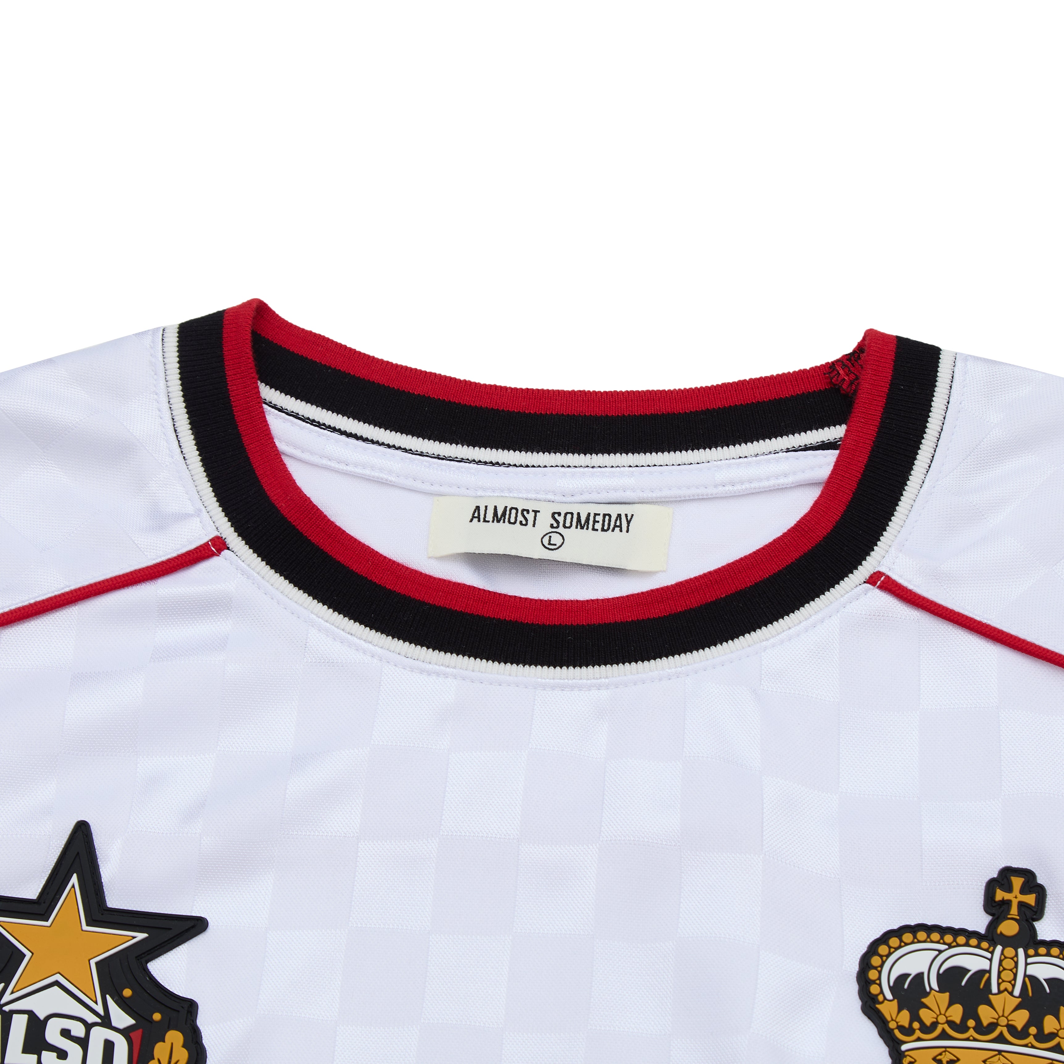 White soccer jersey with red and black trim, featuring logos and 'Almost Someday' label.