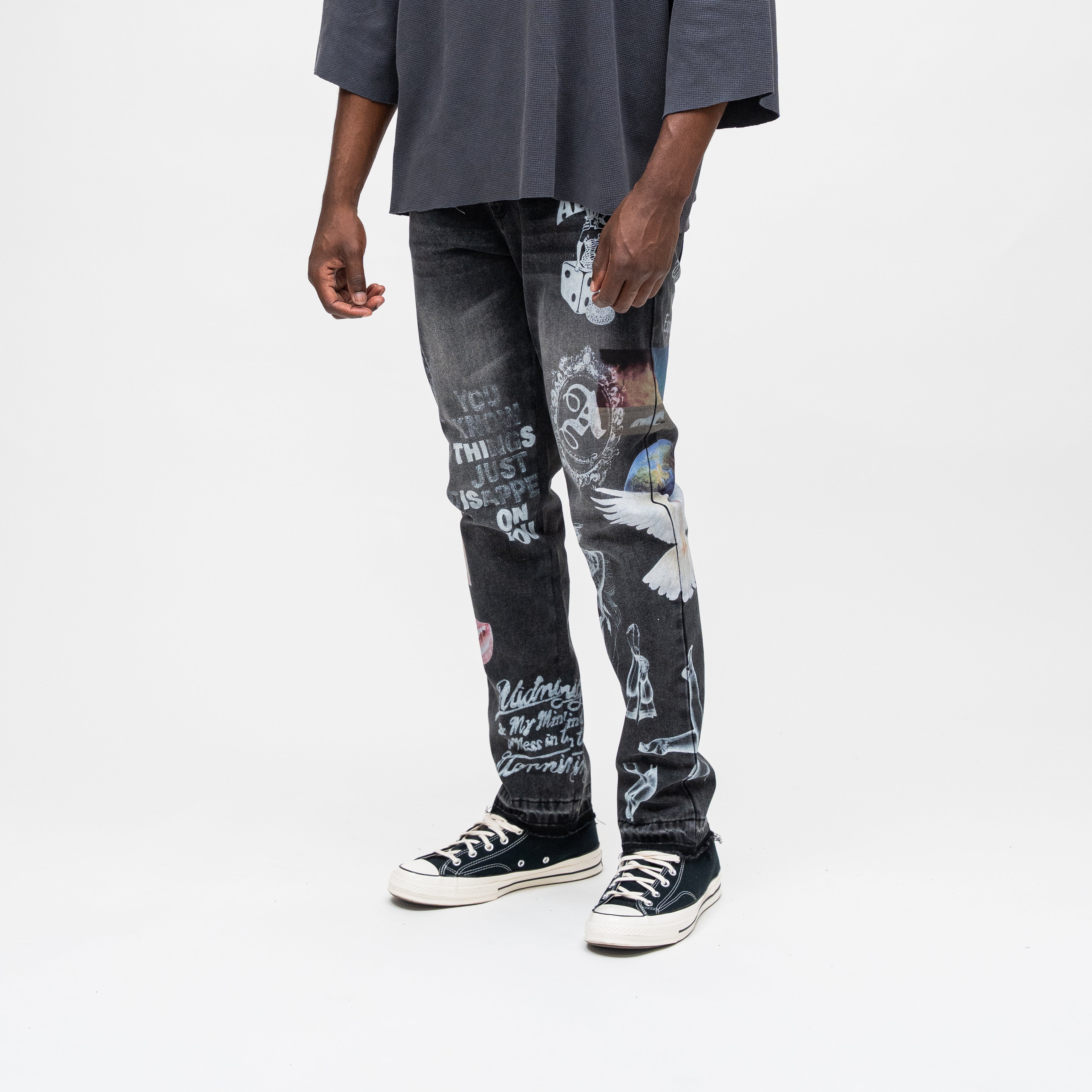 ALMOST SOMEDAY Gallery Denim Pant in Black, angled side view showing You Know This Just Happened On You text and angel figure detail
