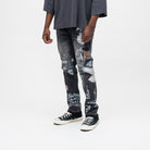 ALMOST SOMEDAY Gallery Denim Pant in Black, angled side view showing You Know This Just Happened On You text and angel figure detail
