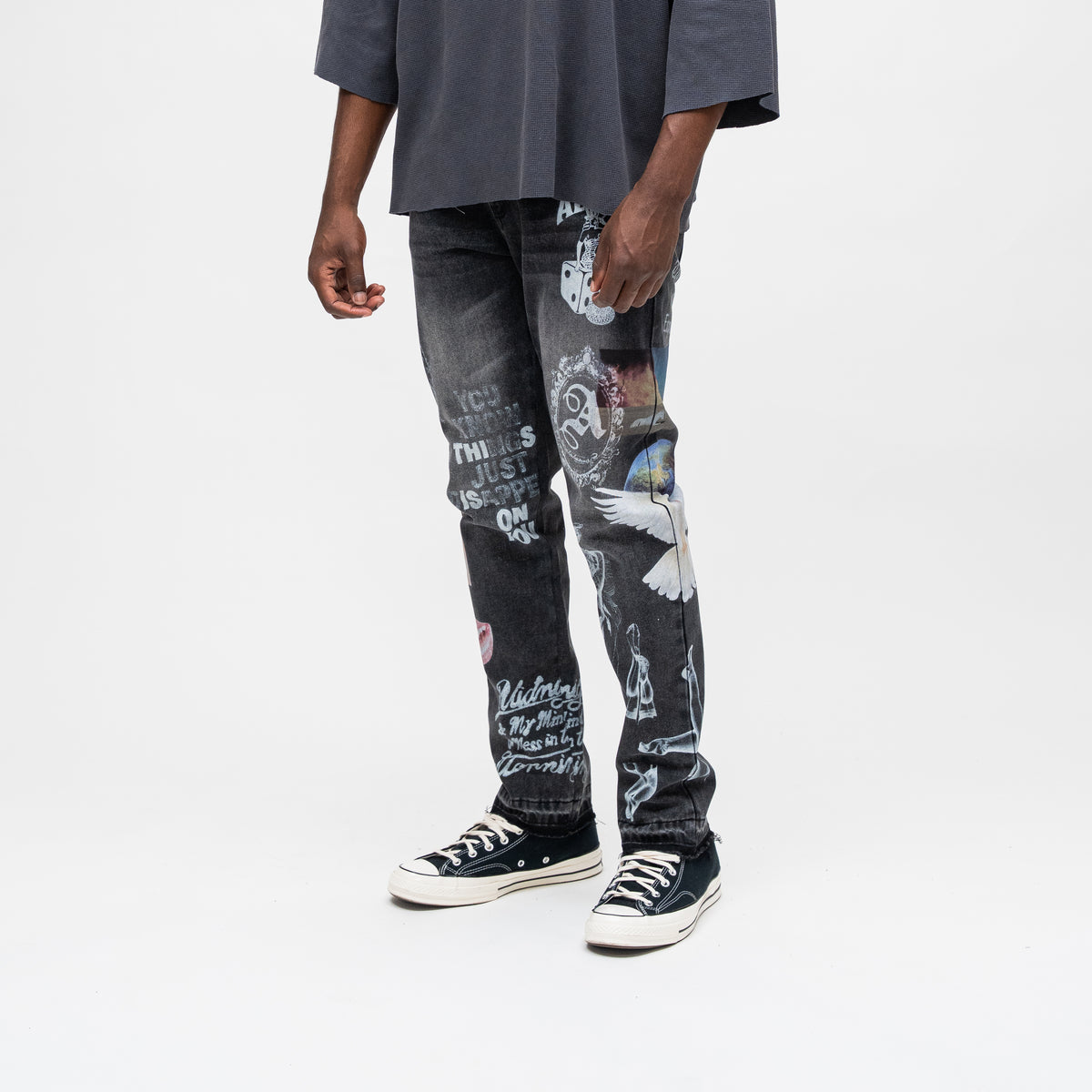 ALMOST SOMEDAY Gallery Denim Pant in Black, angled side view showing You Know This Just Happened On You text and angel figure detail
