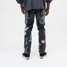 ALMOST SOMEDAY Gallery Denim Pant in Black, back view with The Art of Not Explaining text, architectural illustration, angel wings, and lips graphic