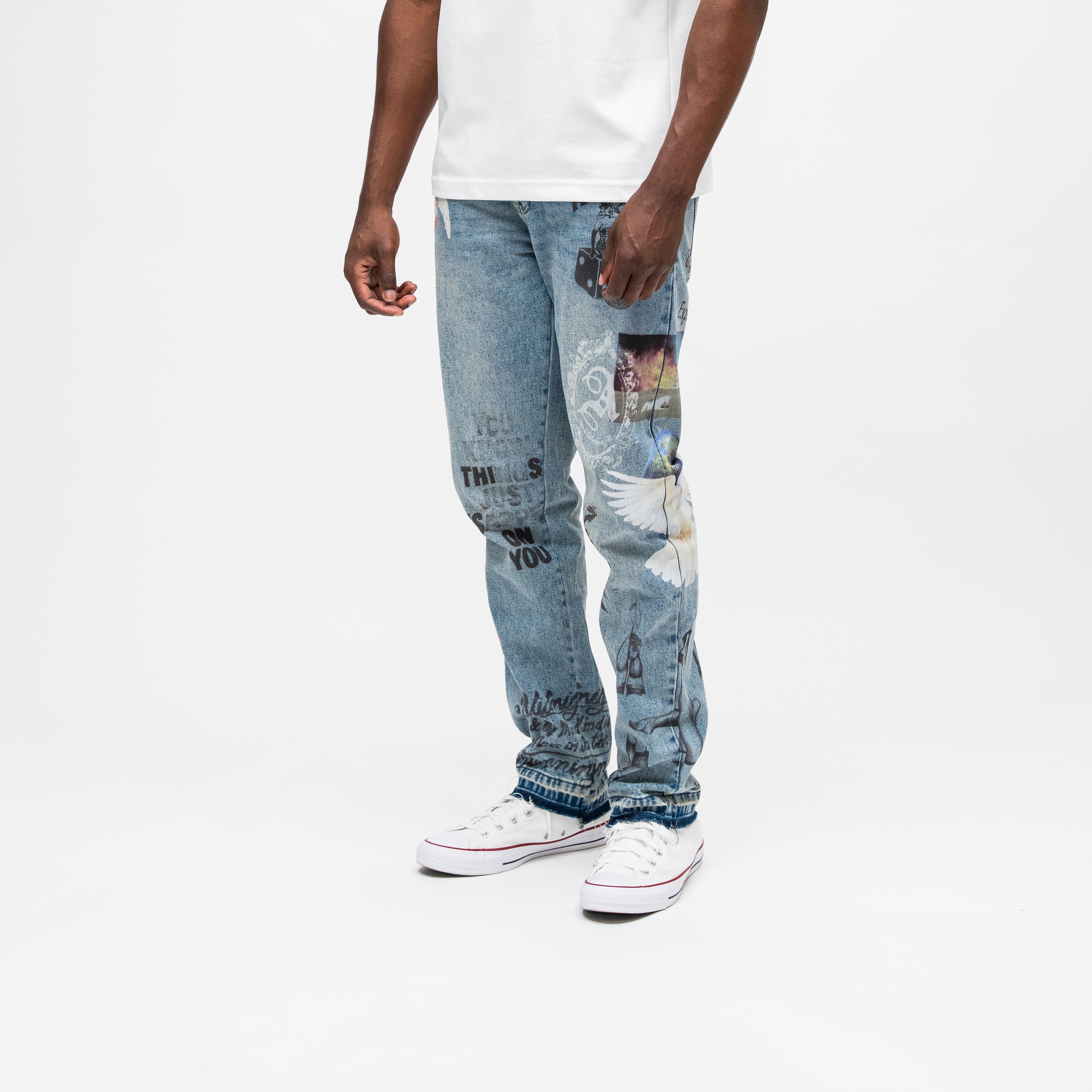 ALMOST SOMEDAY Gallery Denim Pant in Blue Wash, angled side view showing photo patches and This Is On You text graphics
