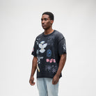 ALMOST SOMEDAY Gallery Tee in Black, angled front view showing Almost Someday script and collage print detail
