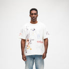 ALMOST SOMEDAY Gallery Tee in Cream, front view with allover collage print of illustrated figures, text, and photography