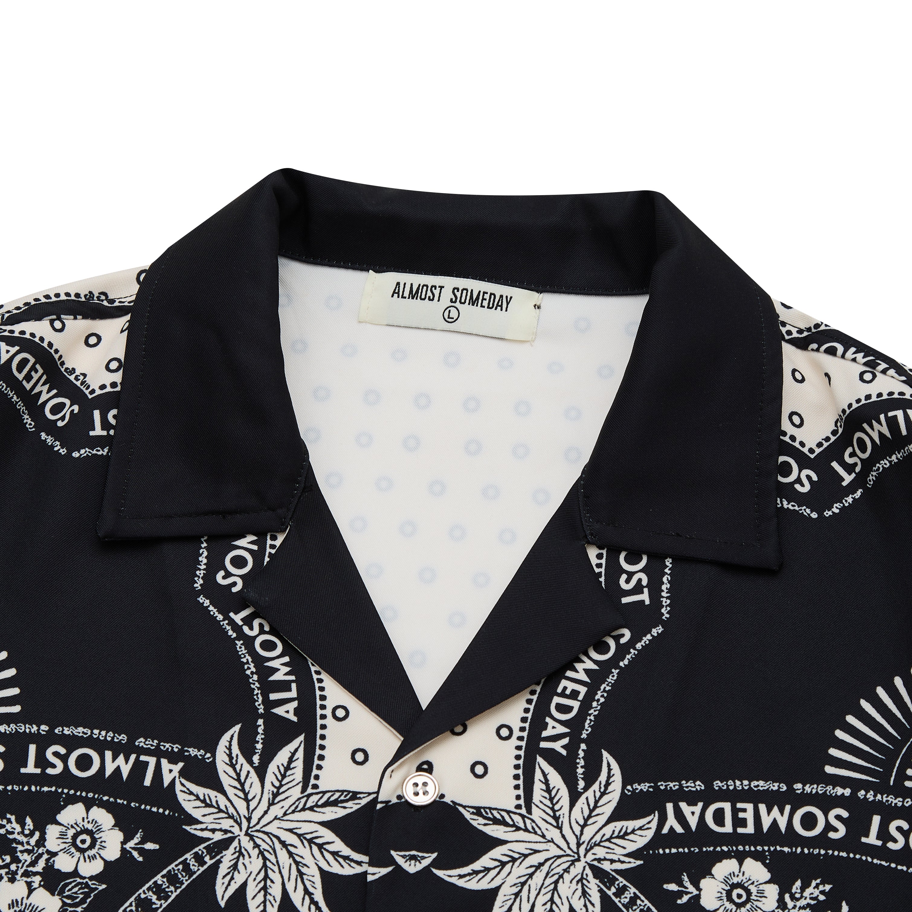 Black shirt with white patterns and 'Almost Someday' text on a white background