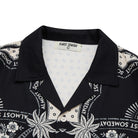 Black shirt with white patterns and 'Almost Someday' text on a white background