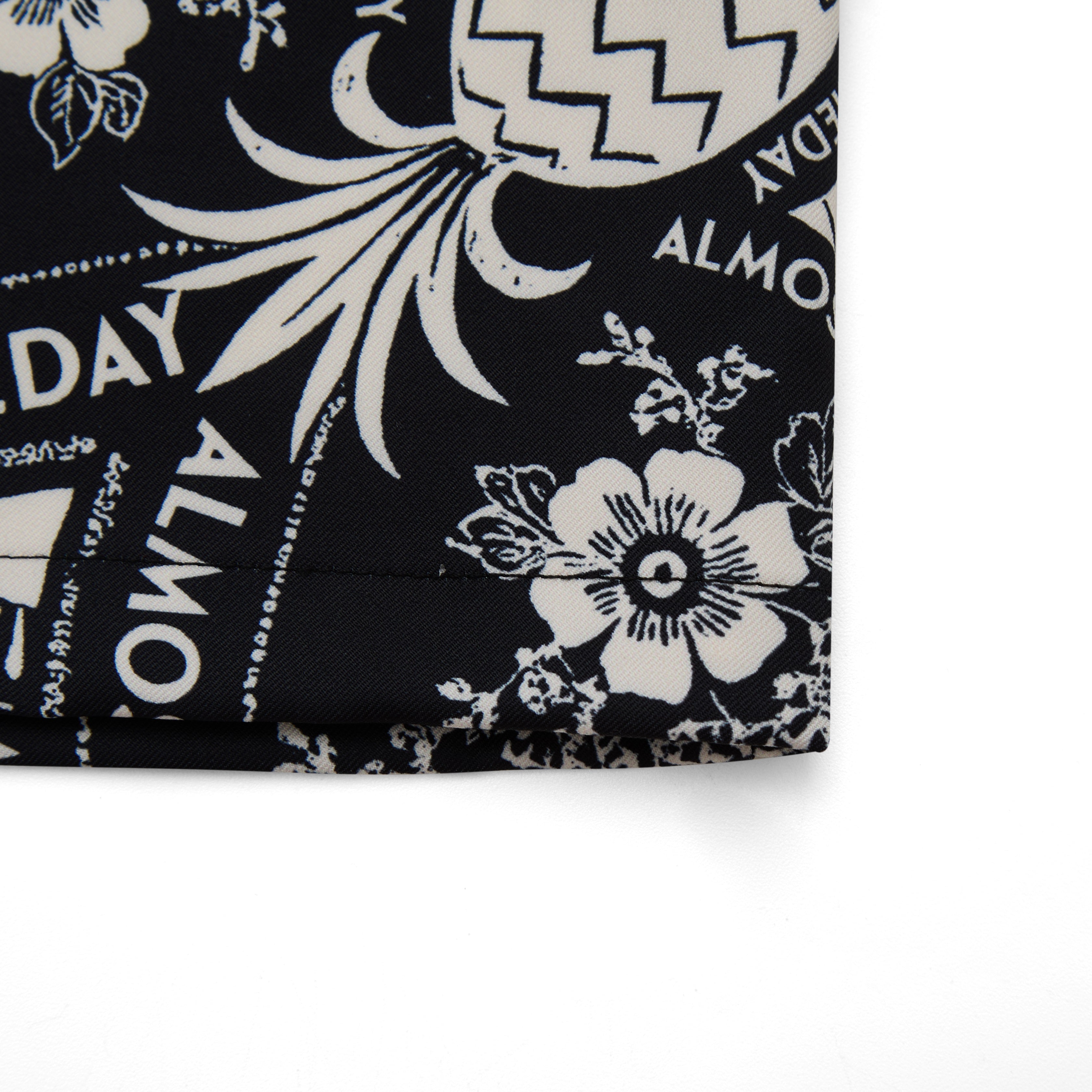 Black fabric with white floral and geometric patterns, featuring the text 'ALMOST SOMEDAY'.