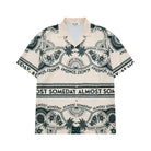 Beige shirt with black text and patterns on a white background