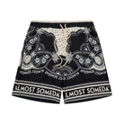 Black shorts with white patterns and 'Almost Someday' branding on a white background