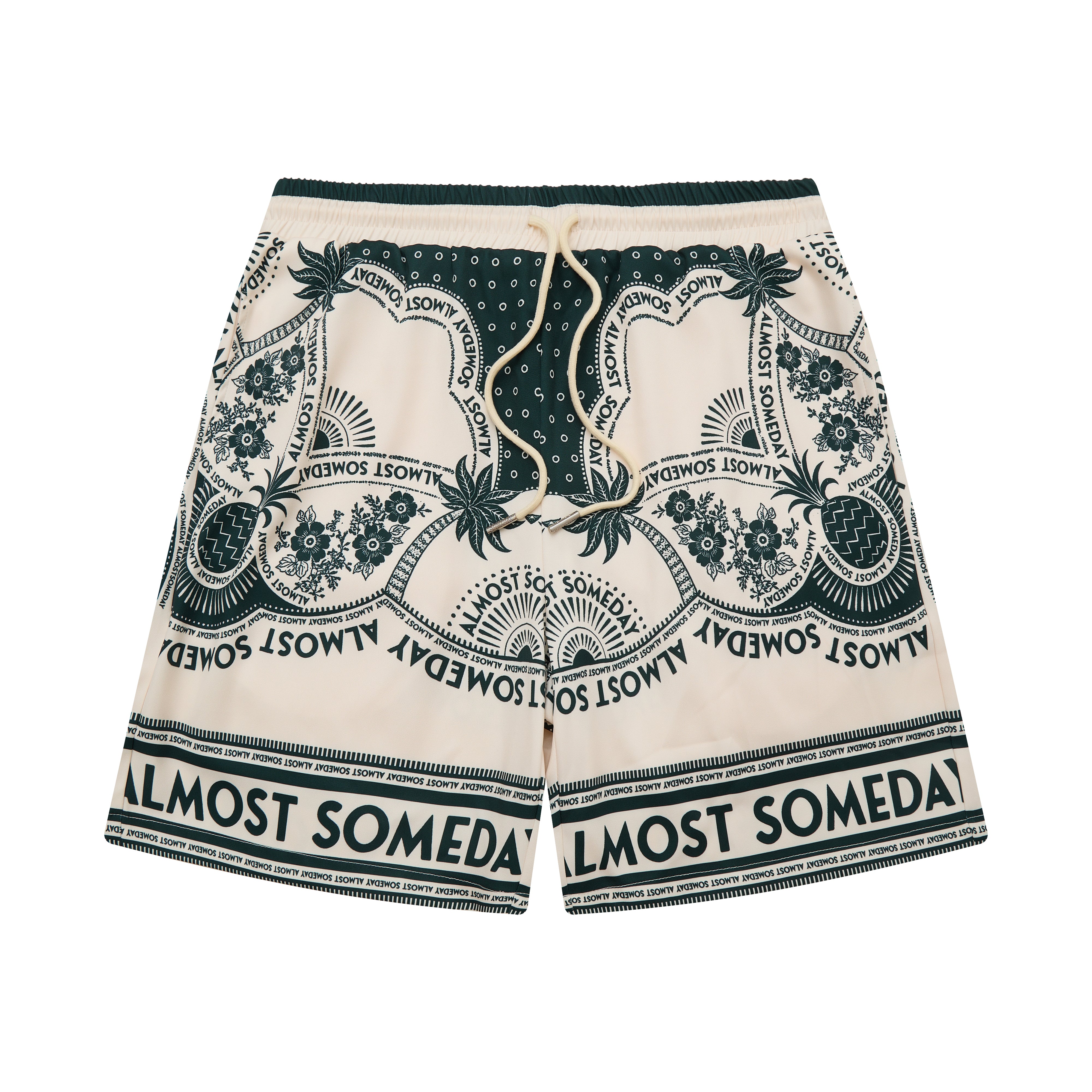 Beige shorts with green pattern and 'Almost Someday' text on a white background