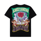 Black t-shirt with colorful graphic design featuring a rose, cherubs, and text on a white background
