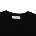 Black shirt with 'Almost Someday' label on a white background