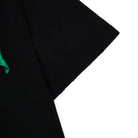Black fabric with a green corner on a white background
