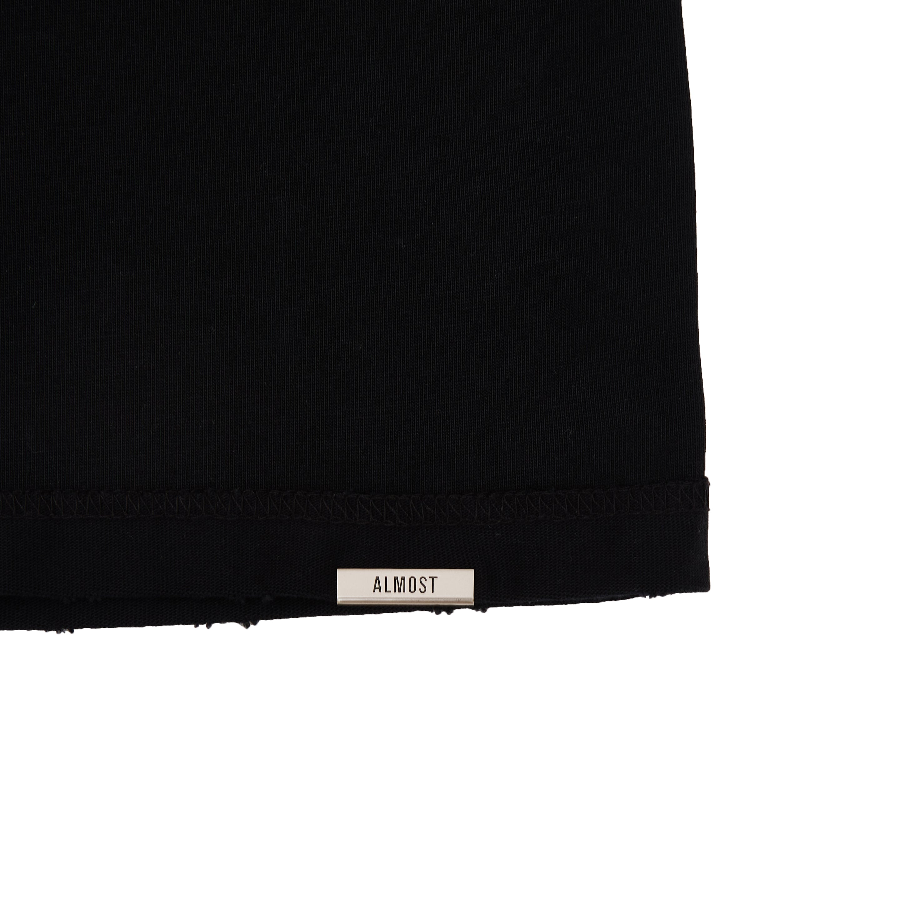 Close-up of a black fabric edge with a 'Almost' label on a white background