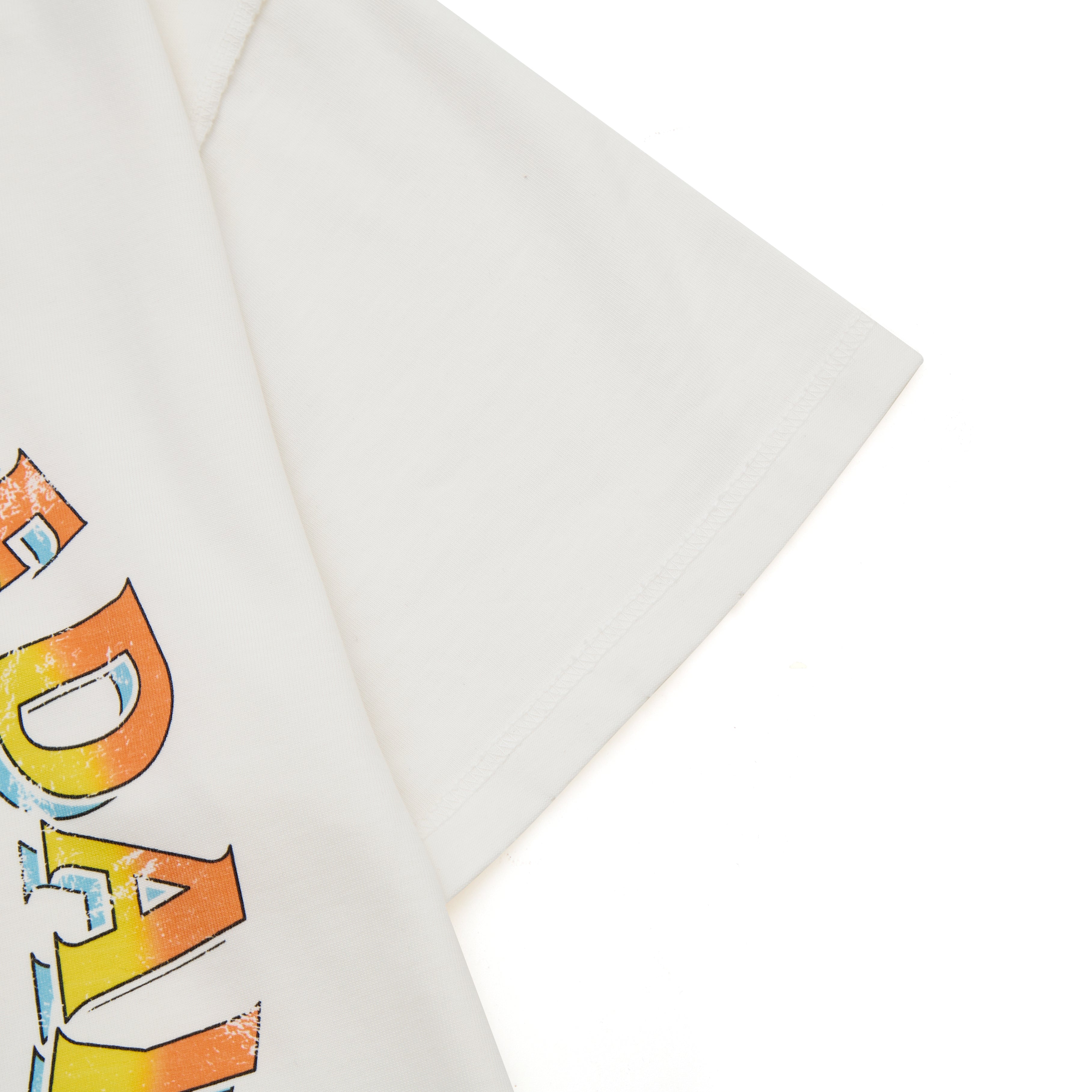 Cream t-shirt with colorful text design on a white background