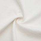 Close-up of beige fabric with a subtle texture