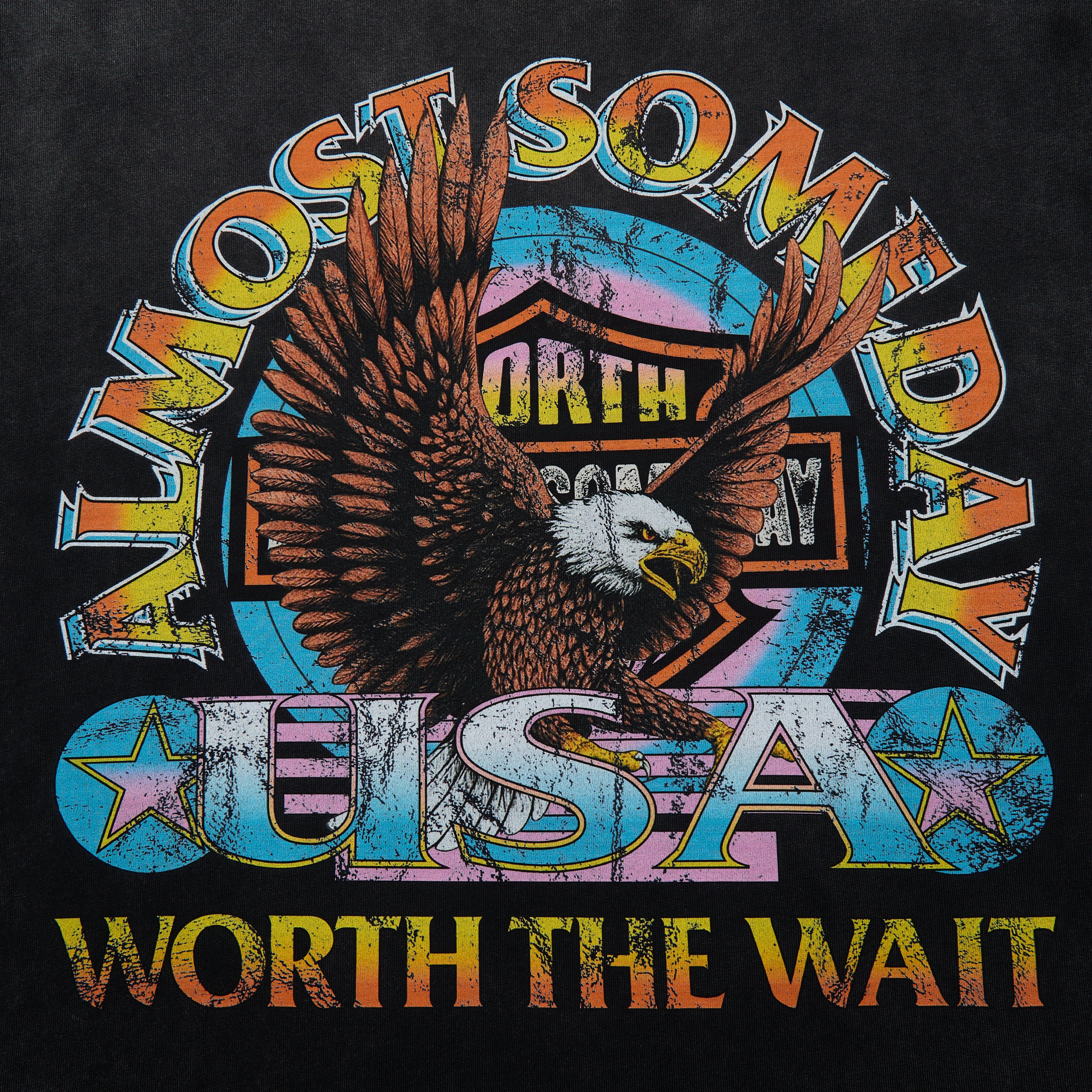 T-shirt design with an eagle and colorful text on a black background
